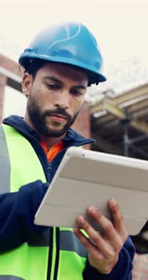 Tablet, man and typing on construction site with developer for building