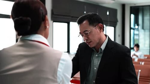 Businessman do flight check in at airport, Business trip.