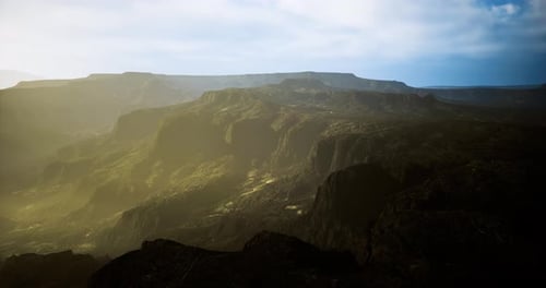 Cinematic Aerial Flight Over Vast Mountainous Landscape