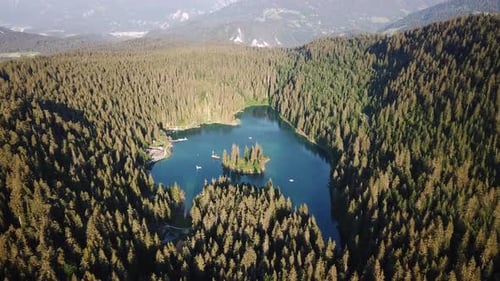 Drone capturing Caumasee, a beautiful alpine lake in Switzerland