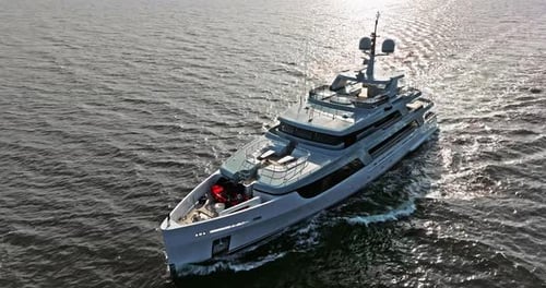 Aerial View Tracking of Beautiful Modern White Superyacht Lifestyle Luxury Boat Sailboat