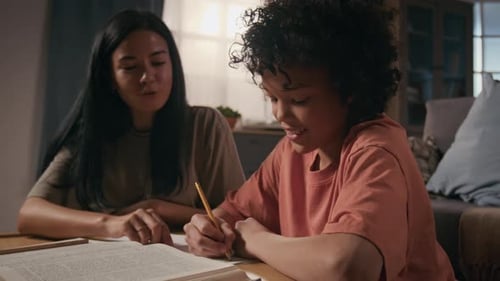 Military Officer Mother Helping Son with School Homework and Patting on Head