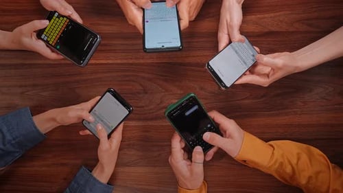 Group of People Engaging in Active Text Messaging Interaction