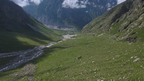 Breathtaking Aerial Footage of a Lush Mountain Valley with a River
