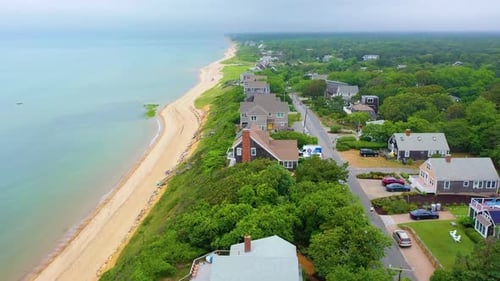 Cape Cod Shoreline Neighborhood with Cloudy Skies and Calm Waters