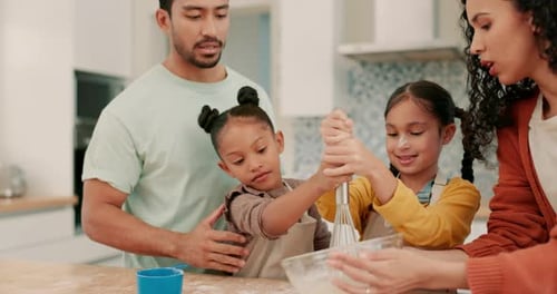 Happy Family Baking Together in Kitchen at Home