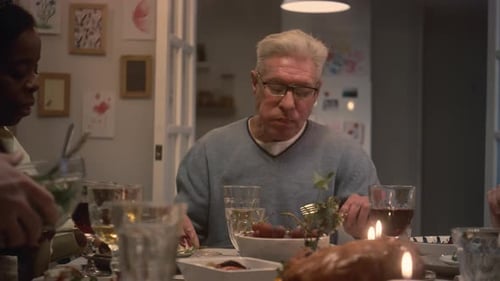 Family Dinner with Warm Candles and Holiday Cheer