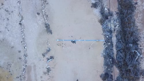 Figures in Military Fatigues in Desert Environment