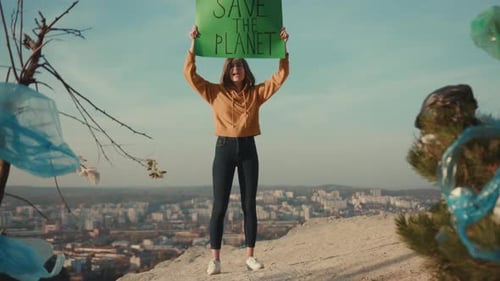 Young Woman Activist Holding Encouraging Green Poster Save the Planet Standing Calls Out Slogans