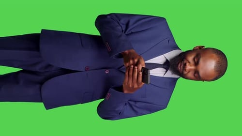 Vertical Video Front View of African American Man Texting Messages Browsing App