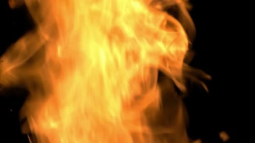 Feuerflamme. Feuerpartikel im Hintergrund