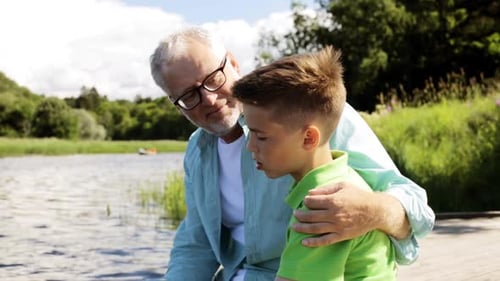 Grandfather and Grandson Enjoying Time Together at Lake