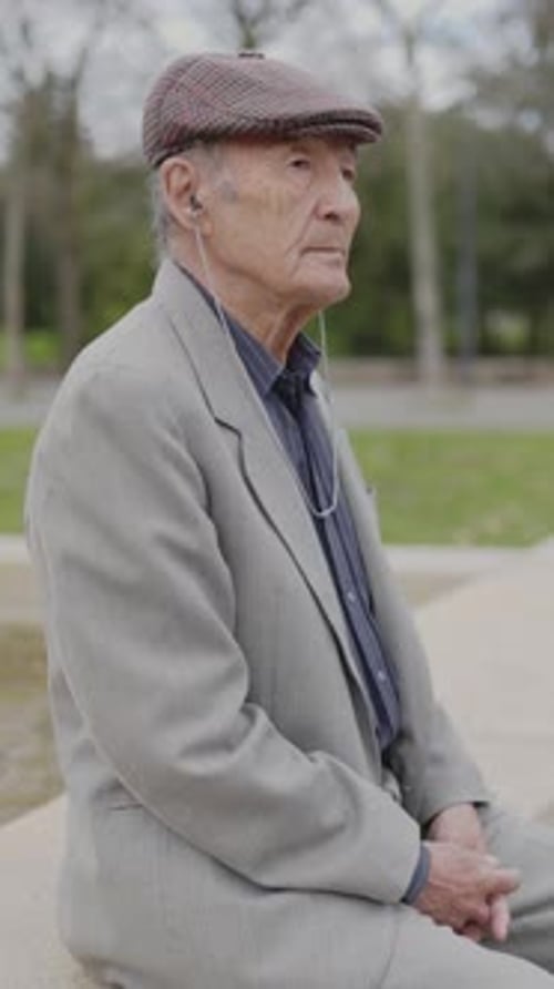 Grandfather Enjoying a Peaceful Moment in a Park