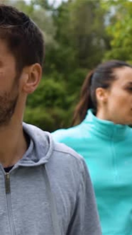 Couple Walking in Park Exercising