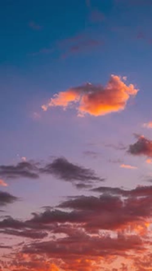 Majestic Golden Hour Clouds Gently Rolling Across the Sky