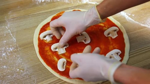 Cooking Traditional Italian Pizza. Close up view of male chef cooking italian pizza