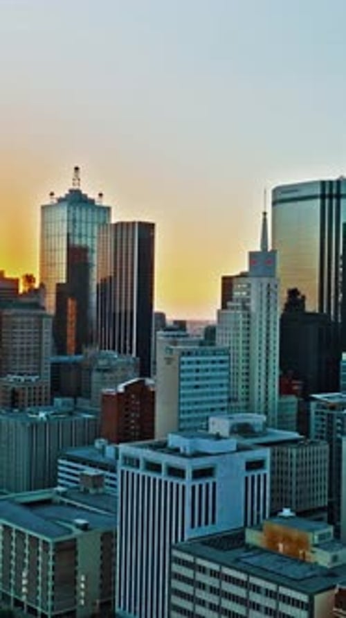 Vibrant sunset over Dallas showcasing skyscrapers and urban life