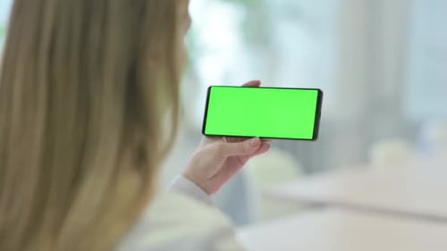 Woman Holding Smartphone with Green Screen Chroma Key