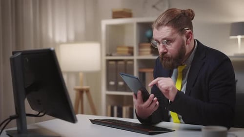 Man Using Tablet in Home Office Workplace