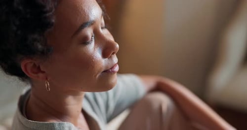 Woman Meditating Indoors in Golden Hour Light