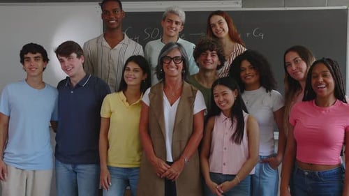 Portrait Group of High School Students with Senior Teacher in Classroom