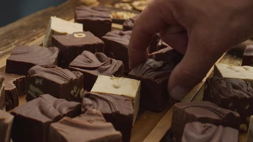 Variety of Handmade Chocolate Fudge on Wooden Tray