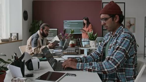 Timelapse of Indian Male Software Engineer Writing Code on Laptop in Office