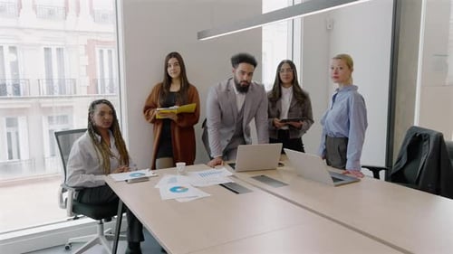 A Diverse Team Collaborates in a Modern Office to Achieve Success and Innovation