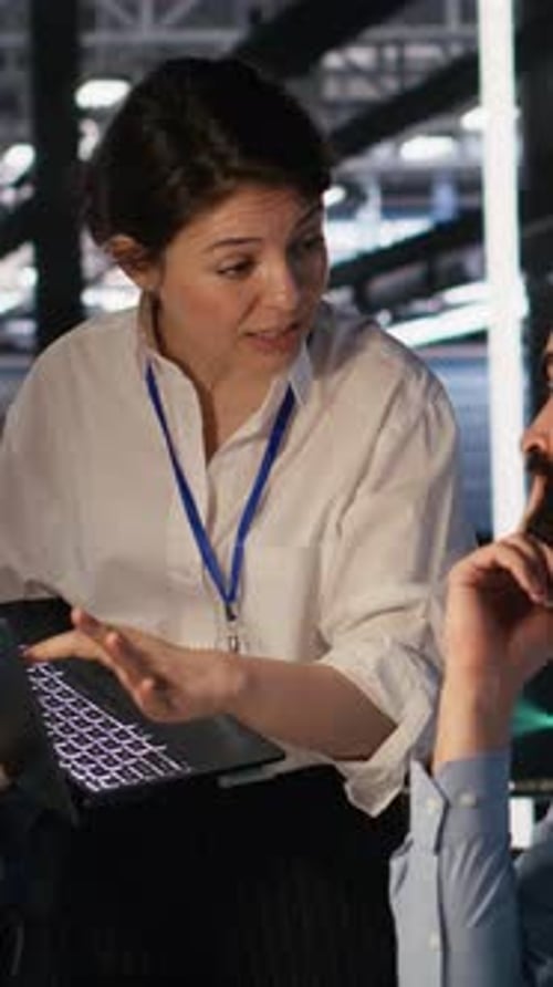 Vertical Video Data Center Admins Working Together Collaborating on AI Software Development