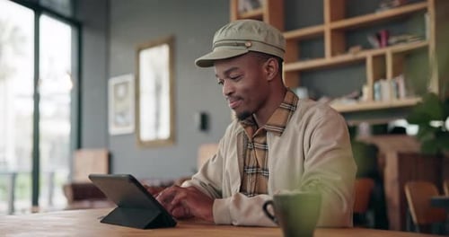 Happy, coffee shop or black man with a tablet, typing or search internet with connection