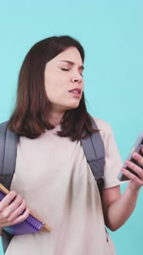 Student Expressing Disappointment While Reading a Text Message
