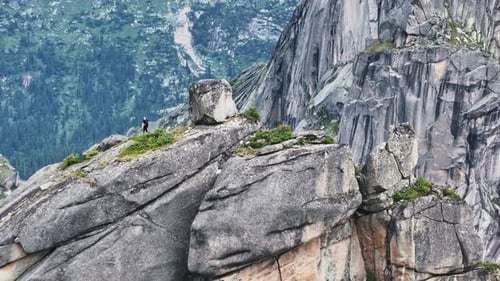 Mountaineer Standing on the Edge of a Cliff in Ergaki Park