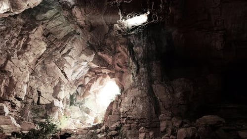 A Cave Filled with Lots of Rocks and Water