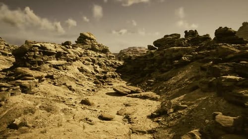 Slow Zoom Out Across Rocky Desert Landscape