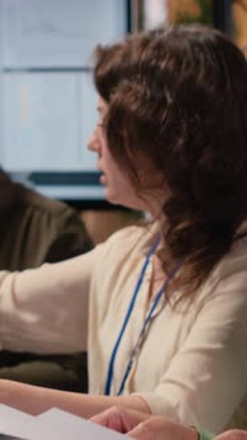 Vertical Video Empowered Businesswomen Evaluating Graphs and Strategy Reports