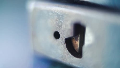 video of a padlock, steel lock close up, security gear, slow motion 120fps, full HD, zoom out smooth