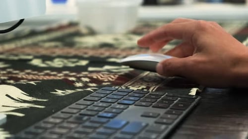 Hand Using Computer Mouse Near Keyboard