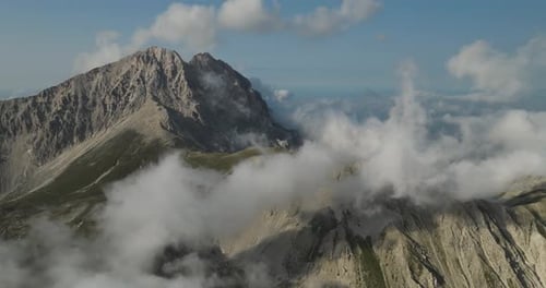 Aerial view of mountains obscured by clouds, Italy.