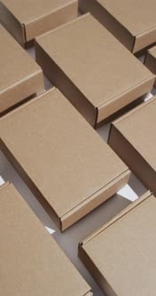 Cardboard Boxes Arranged on a White Surface