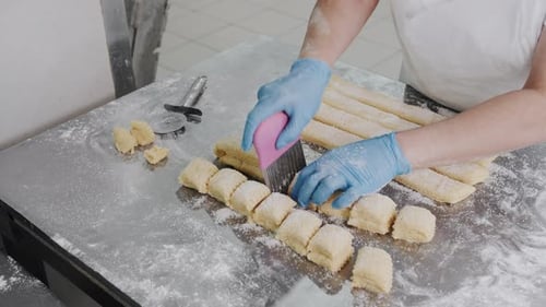 Hand Cutting Cookie Dough Before Baking Dough with Sugar Bakery Production