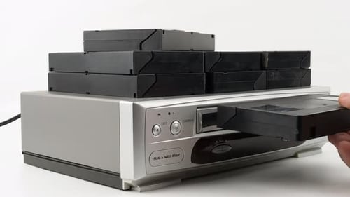 Inserting VHS Tape into VCR Player