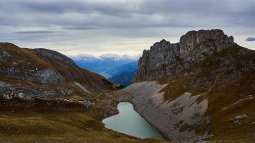 Time Lapse of high mountains and alpine lake (Grubersee) from Rofanspitze in the Austrian alps