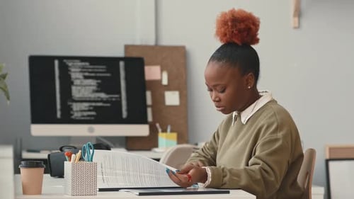 Portrait of African American Female Programmer at Workplace