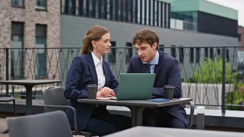 Professional Man Woman Discussing Business Project Sitting Outdoors Restaurant