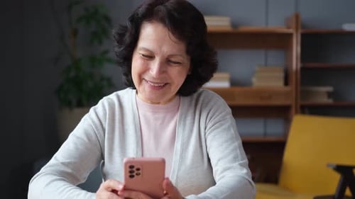 Woman Using Smartphone Indoors