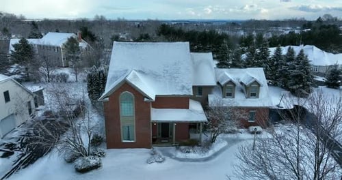 Snow Covered Suburban Homes in Winter Aerial