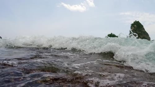 Beautiful Big Sea Wave Breaks on Sand Beach Shore POV Slow Motion