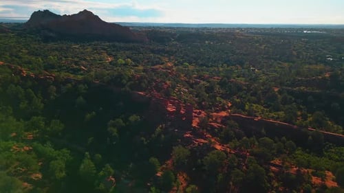 Footage over the vast rocky landscape covered with greenery.