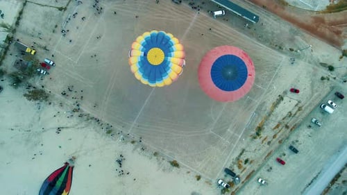 Aerial View of Hot Air Balloons on Field