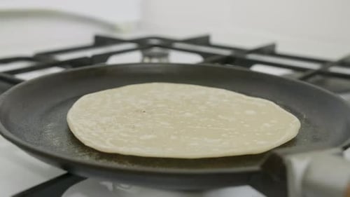 Pita Cooking on the Hot Pan Flipping with Scapula Timelapse Video